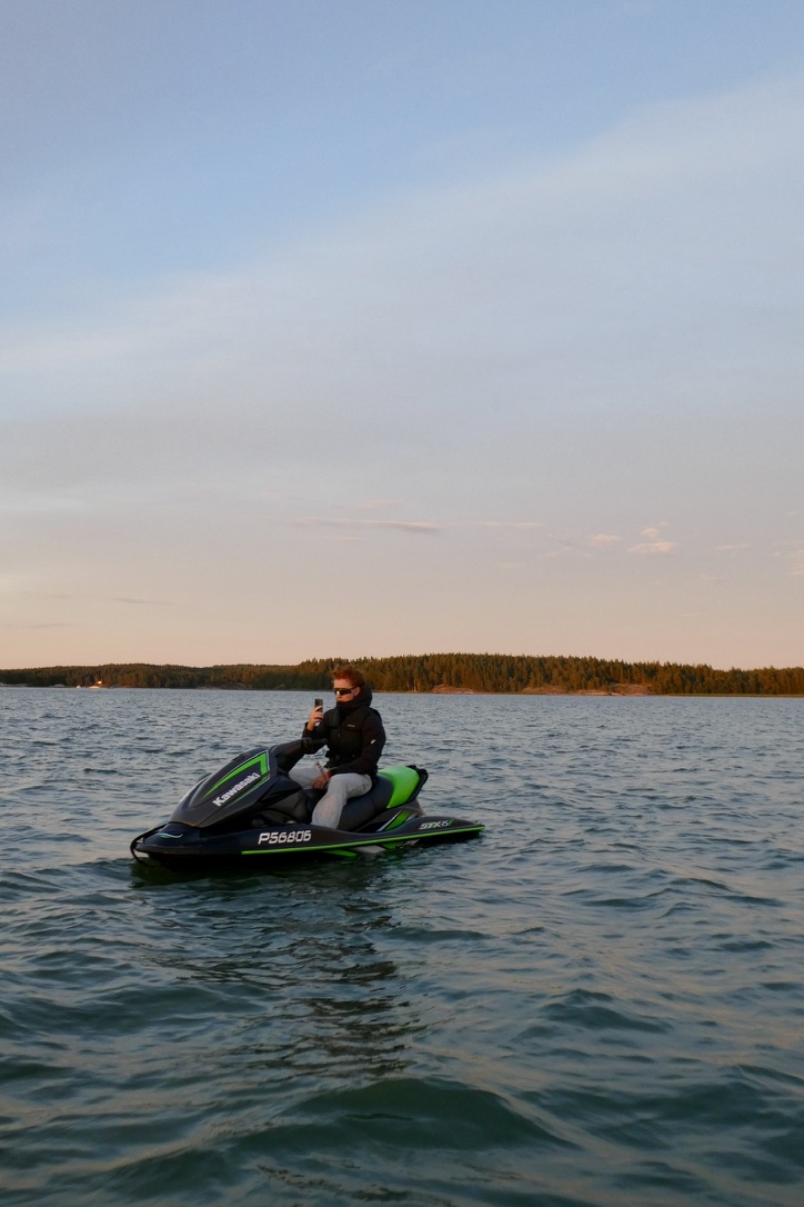 Colin sitting on a jet ski in evening light