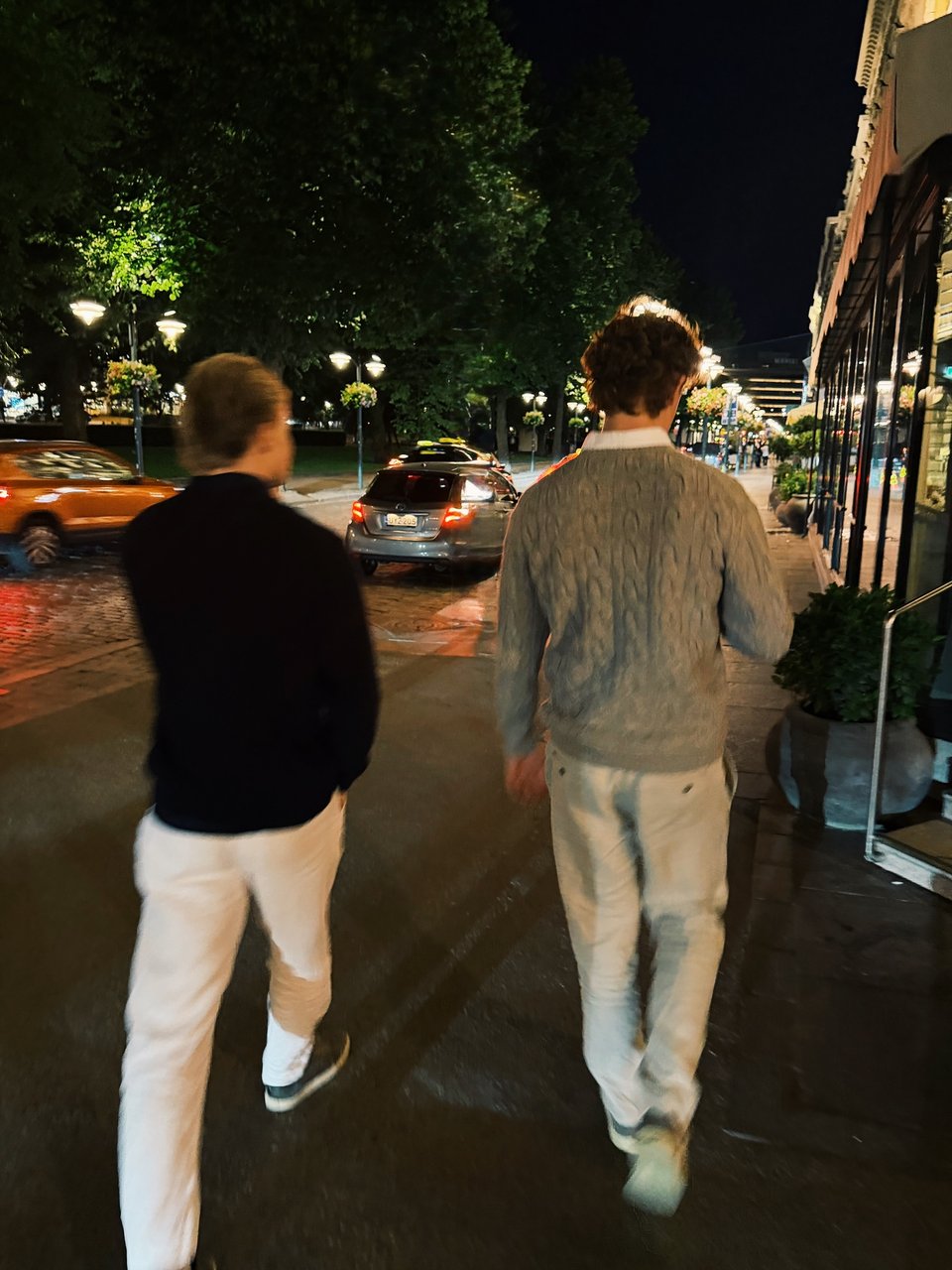 Friends walking through the city after dark