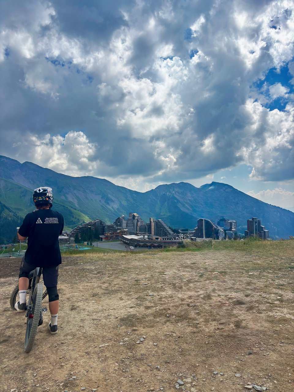 A cyclist looking toward the mountains